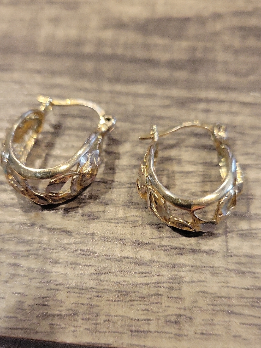Gold Tone Hoop Earrings with Leaf Cutout Design